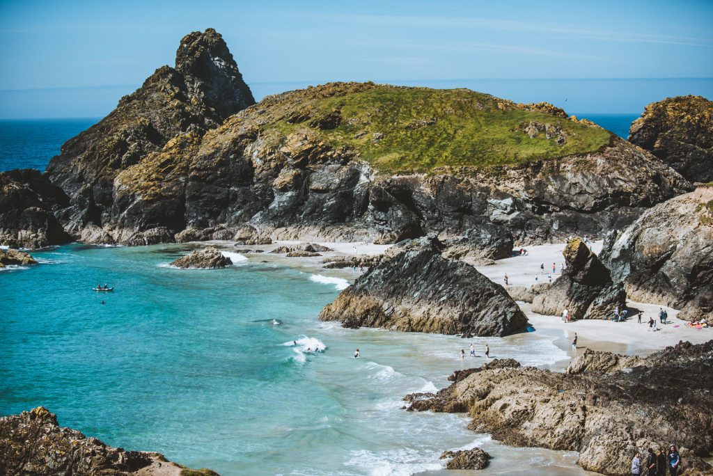 Dramatic Cornwall coastline with rugged cliffs meeting turquoise waters
